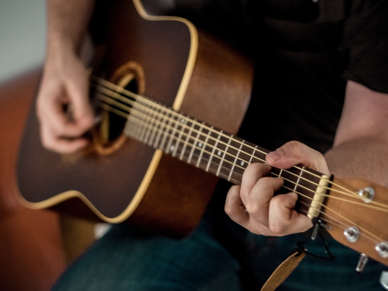 Man playing acoustic guitar