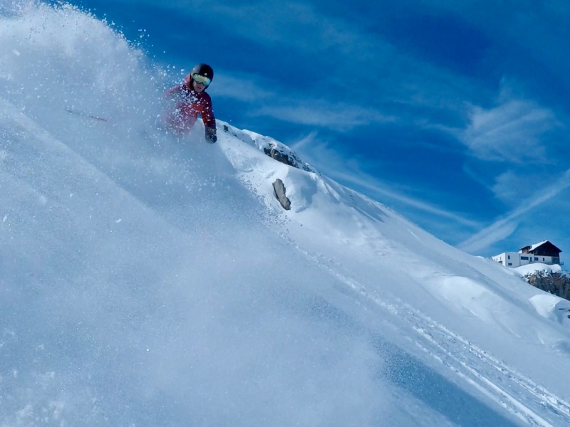 Downhill skiing with blue sky