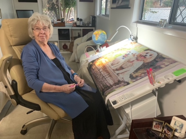 Jean Watford, all organised at her angled art desk